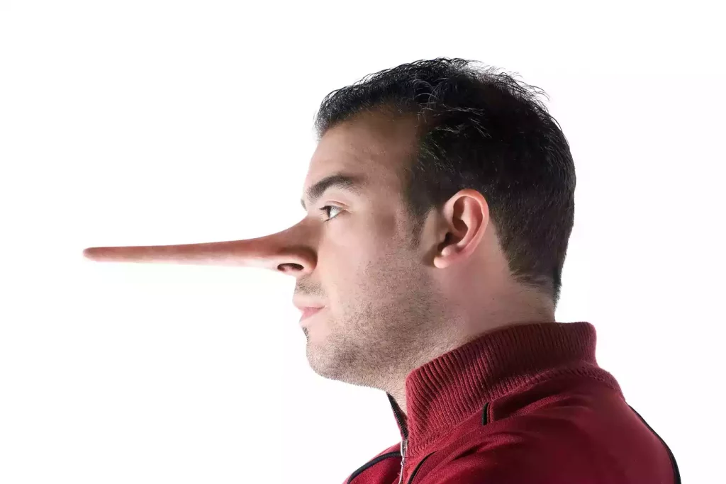profile of a man with a Pinocchio nose