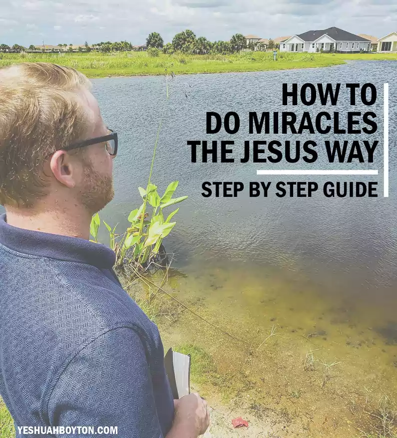 Blond mand overlooking pond with bible in his hand houses in the background